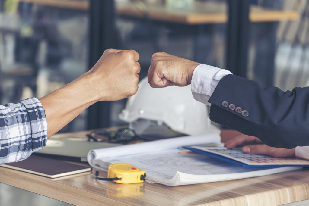 Two Men team fist bump Business Partner Businessman Trust Teamwork Partnership Industry contractor dealing mission business. Mission Business team meeting group of People Fist bump Hands together